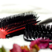 Styling brush A profressional product used by hairdressers to smooth, shape and polish medium to long hair.